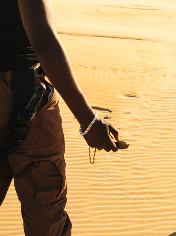 pathfinders in the desert wearing urban sterling bracelet holding compass